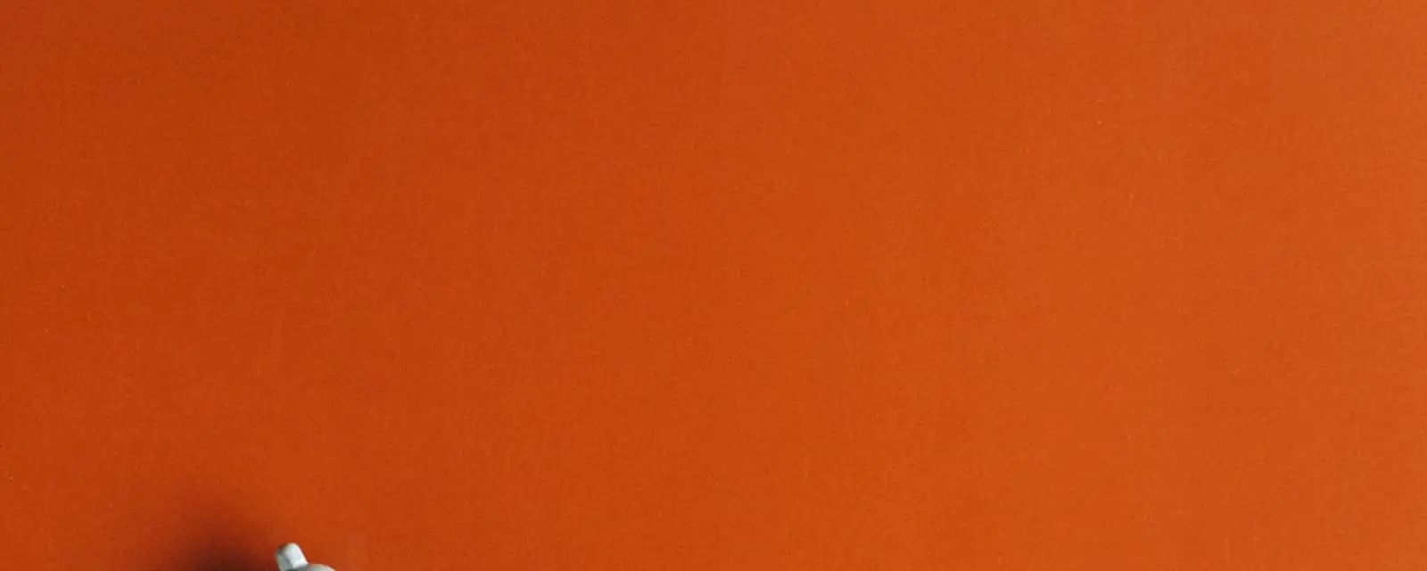 White percent sign and a small clock on orange, illustrating states with no sales tax