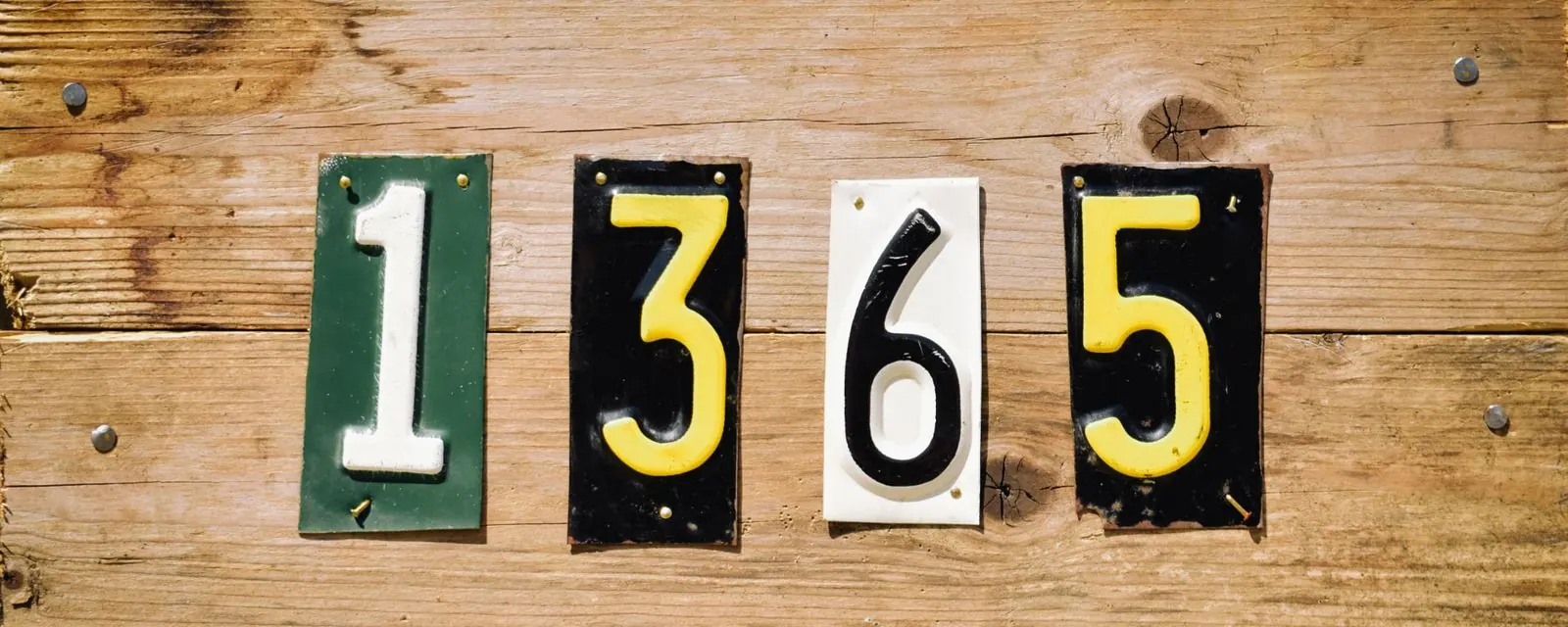 House number plates on a weathered board, illustrating the ZIP code lookup tool