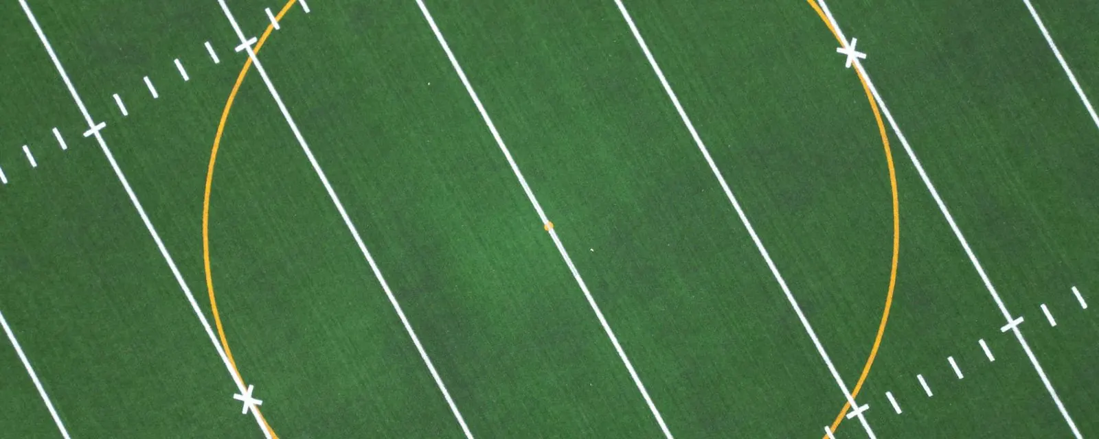 Aerial view of a painted circle on a green field, illustrating the ZIP radius distance tool