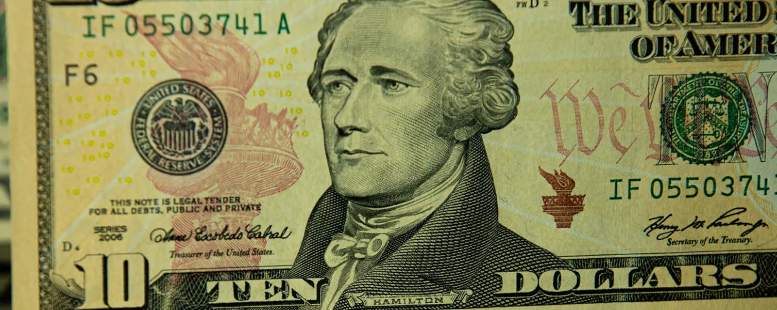 Ten dollar bills on a dark surface, illustrating state sales tax rates