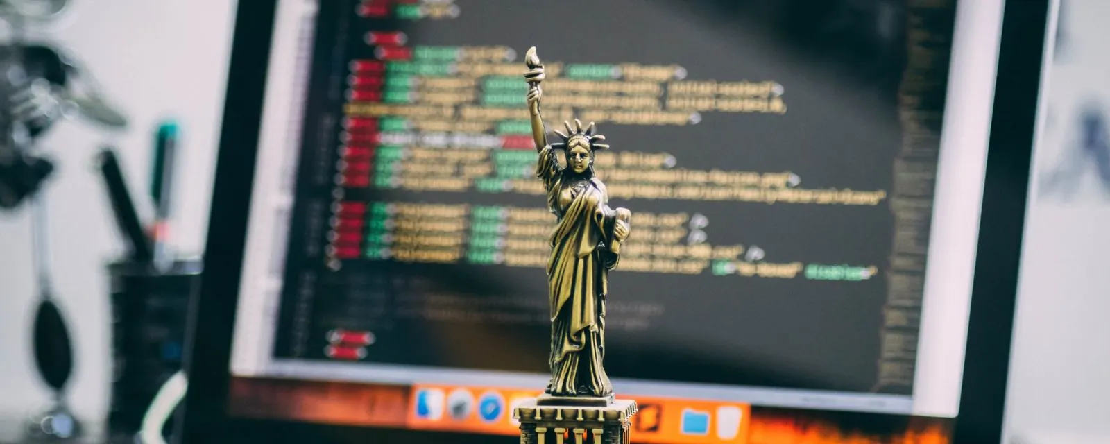 Statue of Liberty figurine on a laptop keyboard, illustrating US telephone area codes